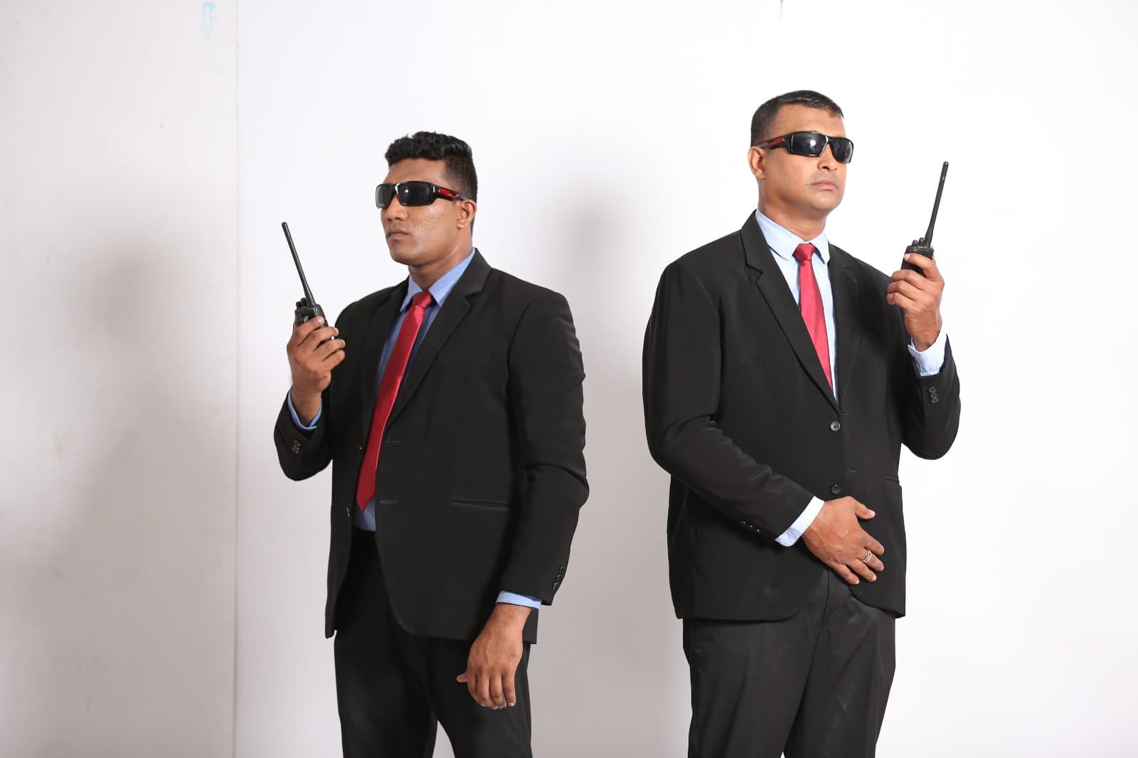 H Hour Security agents in suits with radios